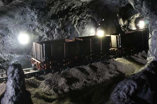 A line of mine trolleys in a mine scene